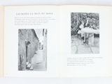 a book open to a picture of a woman and a dog