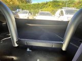 the interior of a car with the door open showing the inside of the vehicle