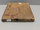 an old book sitting on a table with a tag on it