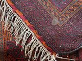 a rug with fringes on it on the floor