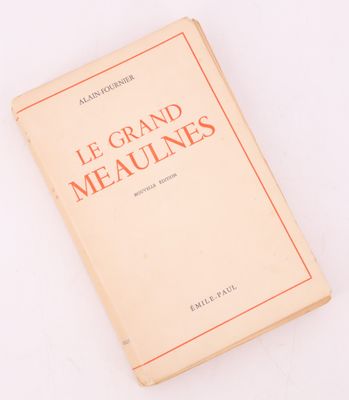 a book on a white surface with a red border