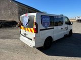 a white van that is parked in a parking lot