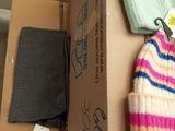 a box with two hats and a pair of pants