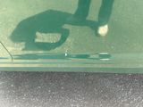 a shadow of a person holding a tennis racquet on a tennis court