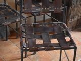 four chairs that are sitting on a tile floor