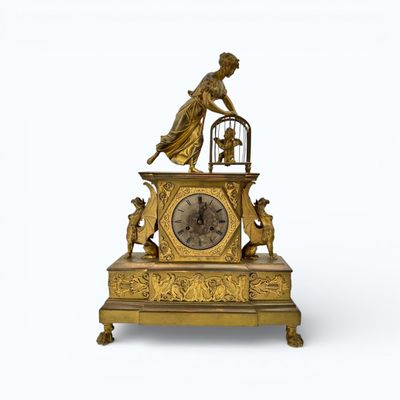 Pendule dite « l’Amour en cage » en bronze ciselé et doré.