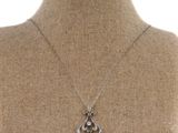 a close up of a necklace on a mannequin mannequin