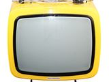 a yellow television sitting on top of a metal stand