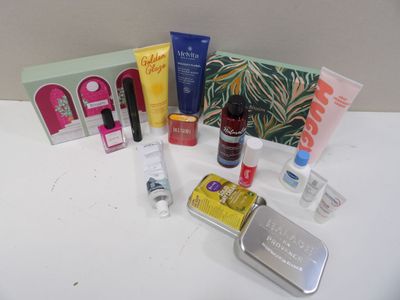 a white table topped with a variety of beauty products