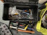 a tool box full of tools sitting on the floor
