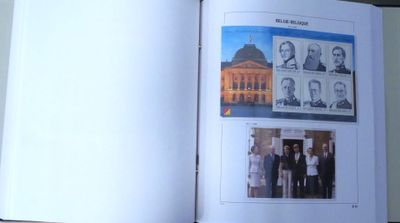 an open book with pictures of people on it