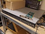 many boxes on a shelf with a laptop on it
