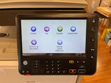 an image of a multi - function printer with a touch screen