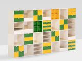 a white shelf with yellow and green squares on it