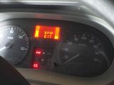 a close up of a car dashboard with a speedometer