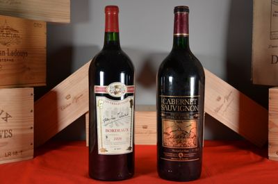 two bottles of wine sitting next to each other on a table