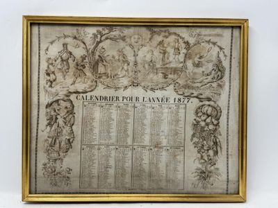 une photo encadrée représentant un calendrier sur lequel figure une photo de famille