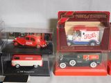 six coca cola truck models in a display case