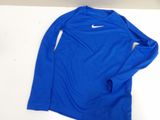 a blue shirt with a white nike logo on it