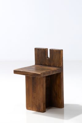 a small wooden table with a small table on top of it