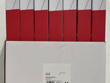 a box with a bunch of red and white papers in it