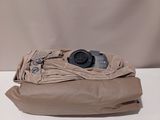 a bag with a camera on top of it on a table