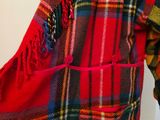 a red plaid shirt with a red tie on it