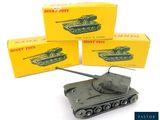 three toy tanks are stacked on top of each other on a white surface