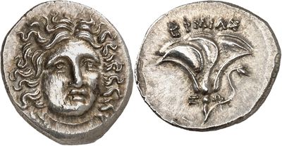 a silver coin with an image of a man ' s face on it