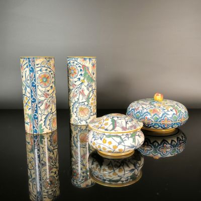 three vases that are sitting on a table