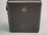 an image of a black and silver radio sitting on top of a table
