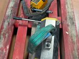 a red pallet with tools on top of it