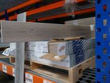 many boxes on the shelves in the warehouse