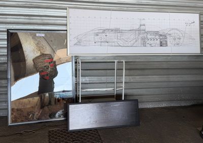 a man standing in front of a drawing of a submarine