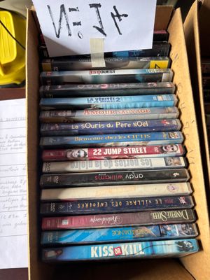 a lot of dvds in a box on the table