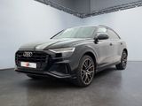 a grey audi q4 parked in a garage