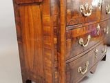 an image of a wooden chest of drawers with marble top