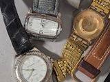 a lot of watches that are sitting on a table