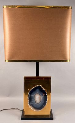 an image of a table lamp with a gold base and a blue agite slice