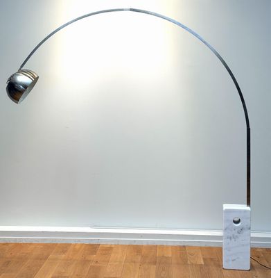 a lamp that is on the floor next to a box