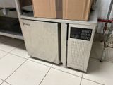 boxes are stacked on top of each other in a kitchen