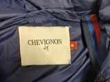 blue down filled jacket with chevgon label on it
