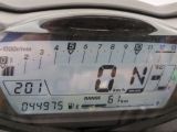 a close up of a motorcycle ' s dashboard with a clock on it
