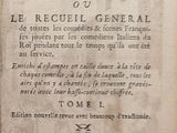 an old book with writing on it sitting on a table