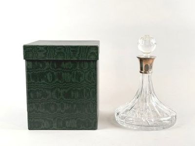 an image of a bottle of perfume sitting next to a box