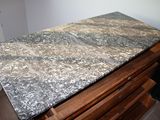 a marble table top on a wooden table in a room