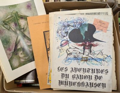 a box full of books and papers on a table