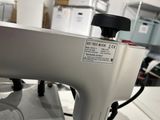 a sewing machine sitting on a table in a room