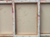 three old wooden frames with paint on them sitting on a table
