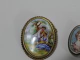 a picture of a picture of a woman and a child on a broochle